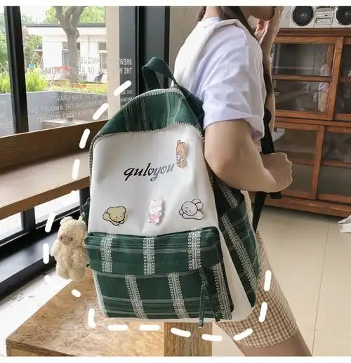 迪阿伦初中生书包女韩版高中学生可爱徽章原宿大学生ins风双肩包