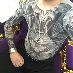 10我想找一会上边不知道是佛还是什么下边是俩佛头上边点有莲花和光线的手镐,就和淘宝