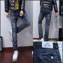 秋冬男下装新款百搭时尚韩版牛仔裤修身小脚绿扣子撞色男裤长裤
