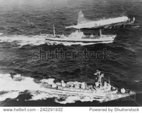 sovietfreighteranesov,escortedbyaunitedstatesnavyplaneandthedestroyer,ussbarry,asitleavescubaloadedwithmiss